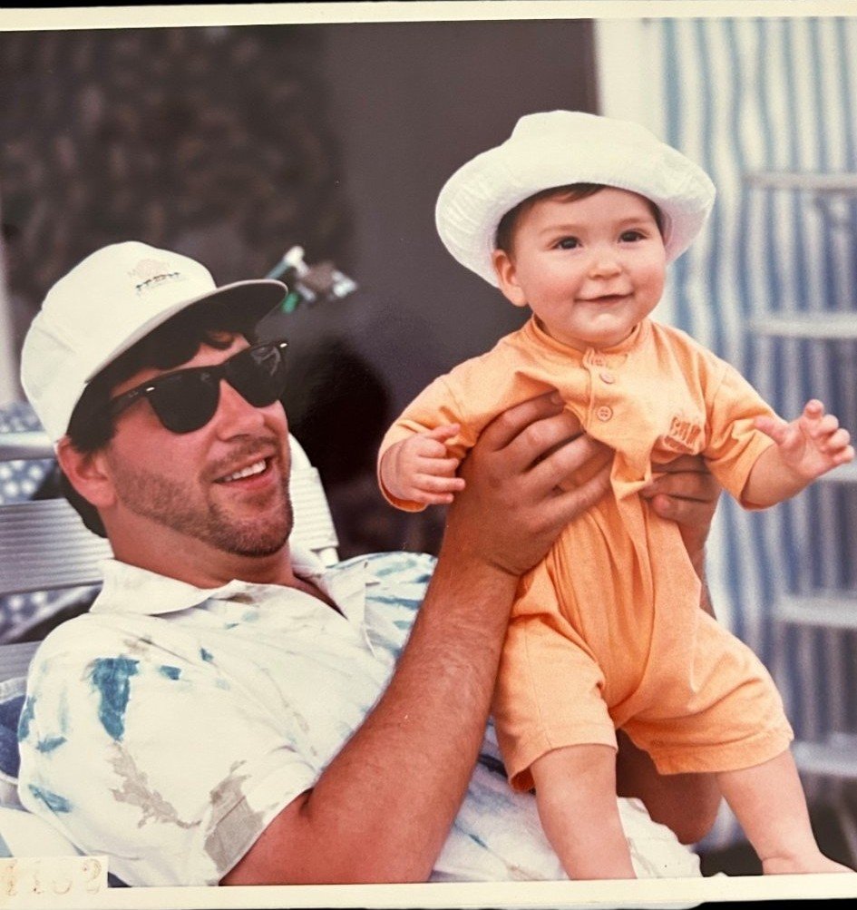 Eric Cimber holding his young son Harrison